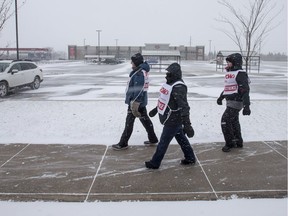 Saskatoon Co-op employees represented by UFCW Local 1400 walk a picket line on 33rd Street West.