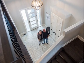 Hospitals of Regina Foundation home lottery grand prize winners Garth Robson, right, and his partner Bev Crossman stand in the entryway to the home they won.