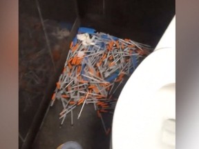 A video taken by Neesha Wolfe at a Regina McDonald's location appears to show multiple needles in the bathroom. SCREENSHOT