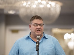 Dr. Brandon Thorpe asks a keynote speaker a question during the Saskatchewan Medical Association Representative Assembly at Hotel Saskatchewan in Regina.