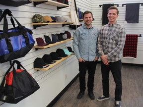 Partner Nathan Hursh, left, stands with Joel Antymniuk, owner of MOTIF Marketing inside MOTIF's First Avenue offices on Dec. 18, 2018. Antymniuk and Hursh hope to bring some new ideas to an older industry, saying they want to go beyond applying business logos to pieces of clothing and merchandise. (Morgan Modjeski/The Saskatoon StarPhoenix)