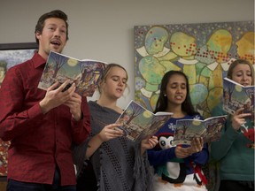 Members of the Greystone Singers, Jordan Kornelsen, Mikaela Nystuen, Anika Sukkhu and Emma Wood, perform at the Saskatoon Symphony Orchestra's new offices on 51st Street in Saskatoon, Sask. on Dec. 5, 2018.