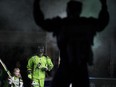 Saskatchewan Rush defender Chris Corbeil runs onto the field with a fan during the game at SaskTel centre in Saskatoon on Saturday, December 8, 2018.