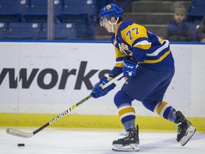 Saskatoon Blades forward Kirby Dach moves the puck against the Brandon Wheat Kings during first period WHL action at SaskTel Centre in Saskatoon, SK on Friday, December 14, 2018. Dach has been named the captain for Team Orr at the Sherwin-Williams CHL/NHL Top Prospects Game.