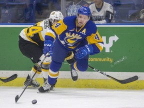 Saskatoon Blades defence Dawson Davidson moves the puck against the Brandon Wheat Kings during first period WHL action at SaskTel Centre in Saskatoon, SK on Friday, December 14, 2018.
