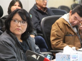 The mother of Brydon Whitstone Dorothy Laboucane,right, looks on as Whitstone's father, Albert, wipes his eyes at a press conference at the Federation of Sovereign Indigenous Nations (FSIN) offices in Saskatoon, Sask. on Dec. 11, 2018. The FSIN has put its support behind the family as it calls for a review into the investigation surrounding the RCMP shooting of Whitstone on Oct 21, 2017.