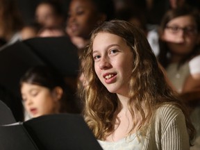 Mikayla Watson, a Gr.8 student at St. Peter School, sings at the Noontime Festival of Carols at TCU Place in Saskatoon, Sask. on Dec. 12, 2018. The event, which sees students from across Saskatoon spreading holiday cheer through song, is in its 47th year in 2018. The choir from St. Peter had more than 70 students from Gr. 4 to Gr. 8 singing Christmas classics like "Little Drummer Boy" and "Feliz Navidad." Running until Dec. 20, the event draws crowds from across Saskatoon.