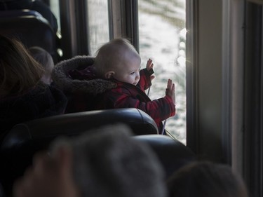 Emerson Haussecker looks out the window during the Magical Christmas Express train that travels from Wakaw to Cudworth near Wakaw,Sk on Saturday, December 15, 2018.