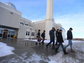 Ahmadiyya Muslim Youth Association president Saeed Dar (centre) leads a youth group out of the Saskatoon mosque on Dec. 15, 2018, to head out on their joint food drive with the Indigenous Students' Council of the U of S.
