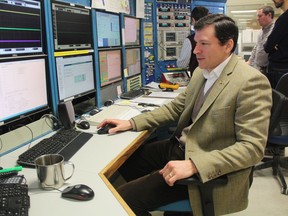 Mark Boland, the machine director at the Canadian Light Source, works in the facility's control room. The light-producing particle accelerator is expected to come back online early next year after it was shut down for six months due to electron gun malfunctions.