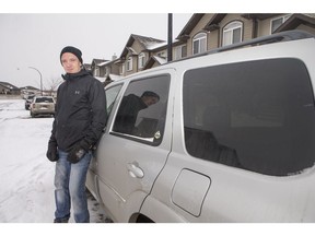 Devin Lewis, who is volunteering his time and his vehicle to offer free rides to New Year's Eve party goers heading to and from celebrations, stands for a photograph with his vehicle in Saskatoon on Dec. 30, 2018.