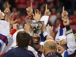 Members of Team Russia celebrate after rallying to defeat Canada 5-3 and winning the 2011 world junior hockey championship.