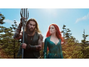 This image released by Warner Bros. Pictures shows Jason Momoa, left, and Amber Heard in a scene from "Aquaman." (Warner Bros. Pictures via AP) ORG XMIT: NYET295