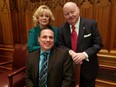 Patrick Brazeau (seated), Pamela Wallin and Mike Duffy pose for a group photo.