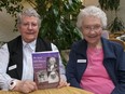 Ursuline Sisters Rosetta Reiniger (L) and Magdalen Stengler display My Soul Still Dances, the book they helped compile in fulfillment of Sister Adelaide Fortowsky's desire to share her journey of living with Parkinson's Disease.