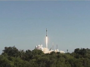 In this still photo from NASA TV, SpaceX launches its unmanned Dragon cargo ship, loaded with supplies, science experiments and food for the astronauts living at the International Space Station from Cape Canaveral, Florida, on December 5, 2018. - SpaceX's Falcon 9 rocket soared into the sunny, blue sky over Cape Canaveral, Florida at 1:16 pm, carrying 5,600 pounds of gear. The mission is SpaceX's 16th for NASA, as part of a long-term contract with NASA to ferry supplies to space.