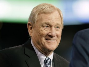FILE - In this Jan. 1, 2017, file photo, former Indianapolis Colts general manager Bill Polian smiles as he's inducted into the team's Ring of Honor during halftime of an NFL football game in Indianapolis. On Tuesday, Nov. 27, 2018, the Alliance of American Football, an eight-team spring league that begins play the weekend after the Super Bowl, will stage a "protect or pick" quarterback draft. The Alliance is the creation of Pro Football Hall of Famer Polian, one of the most respected and accomplished executives in NFL history, and Charlie Ebersol, a longtime TV and film producer.