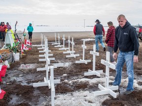 Rocky Salisbury of Nipawin sets up crosses on April 14, 2018, at the intersection of Highway 35 and Highway 335, north of Tisdale, where a collision occurred involving the Humboldt Broncos hockey team bus on April 6, 2018, that resulted in the death of 16 people. He said he didn't know any of the players personally, but he made the crosses out of respect and so that people visiting the site could visualize how many lives were lost.