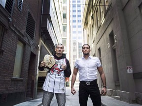 Featherweight champion Max Holloway, left, and unbeaten challenger Brian Ortega pose for a photograph before their upcoming UFC 231 title fight in Toronto on October 10, 2018.