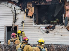 REGINA, SASK : December 18, 2018 -- Firefighters work to extinguish a house fire on 4th Avenue. BRANDON HARDER/ Regina Leader-Post