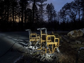 Scorched wheelchairs rest outside Cypress Meadows Post-Acute, a nursing home leveled by the Camp Fire, on Tuesday, Dec. 4, 2018, in Paradise, Calif.