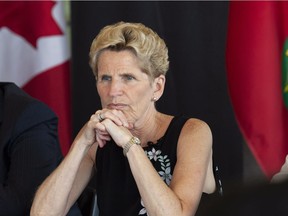 Former Ontario Liberal Party Leader Kathleen Wynne listen to students at the University of Waterloo during a campaign stop in Waterloo, Ont., on Friday, June 1, 2018.