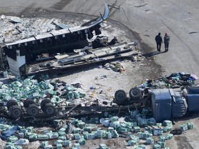The wreckage of a fatal bus crash carrying members of the Humboldt Broncos hockey team is shown outside of Tisdale, Sask., on April, 7, 2018. The Saskatchewan government is introducing mandatory training for semi truck drivers almost eight months after the Humboldt Broncos bus crash. Drivers seeking a Class 1 commercial license will be required to undergo at least 121.5 hours of training starting in March 2019. Sixteen people died and another 13 were injured in April when the Broncos's team bus collided with a semi at a rural Saskatchewan intersection.