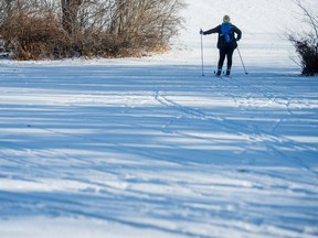 A cross-country skier enjoys Wascana Park.