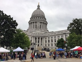 This Sept. 24, 2016 photo shows the Dane County Farmers' Market in Madison, Wis., which takes place Saturdays around the state Capitol building.
