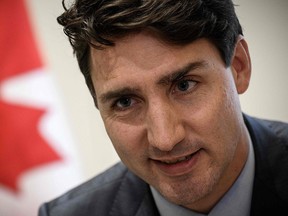 Prime Minister Justin Trudeau looks on during an interview at the Canadian Embassy in Paris on Nov. 12, 2018.