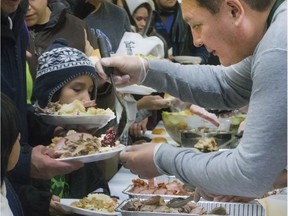 Volunteers serve hundreds at the Saskatoon Tribal Council's Annual Community Christmas Celebration at the White Buffalo Youth Lodge, Dec. 15, 2016.