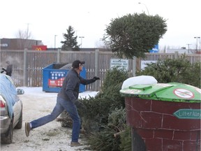 Bob Fawcett throws out his Christmas tree into the City of Saskatoon recycling pile just off of Lowe Road on Jan. 5, 2019.