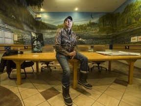 Pinehouse Mayor Mike Natomagan sits for a photograph in the boardroom of the village office in Pinehouse, SK on Wednesday, January 16, 2019.
