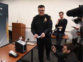 Saskatoon Police Service Staff Sergeant Patrick Barbar demonstrates how to use the new Draegar DrugTest 5000 device at the police station in Saskatoon on Jan. 24, 2018.