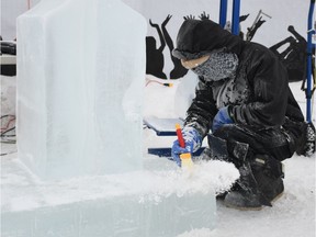Jeffrey Book with Fire and Ice Creations works on an ice sculpture at Wintershines at the farmer's market in Saskatoon on Jan. 26, 2019.