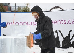 Jeffrey Book with Fire and Ice Creations works on an ice sculpture at Wintershines at the farmer's market in Saskatoon on Jan. 26, 2019.