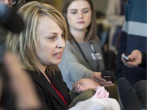 Celeste Leray-Leicht, the mother of Jacob Leicht, holds Lilly Brons, the daughter of former Humboldt assistant coach, and survivor, Chris Beaudry (not pictured) while speaking to media at the Kerry Vickar Centre, which is being used for the sentencing hearing of semi driver Jaskirat Singh Sidhu (not pictured), in Melfort, SK on Wednesday, January 30, 2019. Baby Lilly is named after Broncos athletic therapist Dayna Brons, who died in the crash.