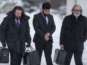 Jaskirat Singh Sidhu, the driver of a transport truck involved in the deadly crash with the Humboldt Bronco's bus, and his lawyers Mark Brayford, left, and Glen Luther enter the Kerry Vickar Centre, which is being used for Sidhu's sentencing hearing, in Melfort, Sask. on Thursday, Jan. 31, 2019.