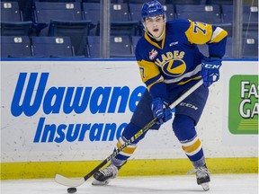 Saskatoon Blades forward Kirby Dach moves the puck against the Prince Albert Raiders during WHL action at SaskTel Centre in Saskatoon on Sunday, October 14, 2018.