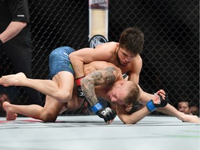 Henry Cejudo fights against TJ Dillashaw during their UFC Flyweight title match at UFC Fight Night at Barclays Center on January 19, 2019 in New York City.