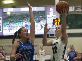 Huskies guard Kelsey Lalor goes to shoot the ball as Lethbridge wing Amy Mazutinec defends during Canada West conference women's basketball action at the PAC gym in Saskatoon on Friday, January 4, 2019.