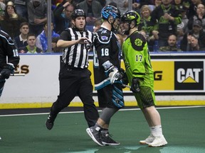 Rochester's Jake Withers and Saskatchewan's Robert Church stare each other down during NLL action Saturday.