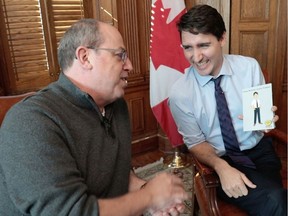 Prime Minister Justin Trudeau holds an animation of himself as he speaks with actor Brent Butt in this undated handout photo. Justin Trudeau will follow in the footsteps of two previous prime ministers by appearing in an episode of "Corner Gas." The show's Facebook page said on Saturday that Trudeau will play himself on an episode of "Corner Gas Animated" when its second season debuts this spring on The Comedy Network.