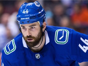 Vancouver Canucks' Erik Gudbranson lines up for a faceoff against the Colorado Avalanche during the first period of an NHL hockey game in Vancouver, B.C., on Tuesday February 20, 2018.