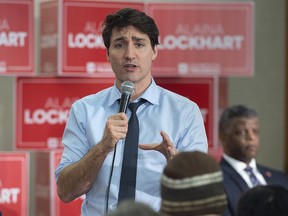 Prime Minister Justin Trudeau takes a photo with a group of young people as he attends Fundy Royal MP Alaina Lockhart‚Äôs nomination event in Quispamsis, N.B., on Wednesday, Jan. 23, 2019.