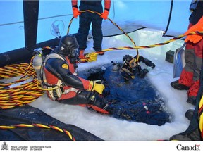 Divers from both the Saskatchewan and Manitoba RCMP take part in a recovery mission at a historic plane crash in Peter Pond Lake in the province's north. RCMP were able to recover the remains of Ray Gran, who was piloting the plane, and Saskatchewan conservation officer Harold Thompson. RCMP also recovered several artifacts believed to be personal belongings of the two men who died when their plane went down in 1959.