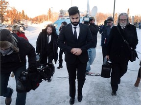 Jaskirat Singh Sidhu, centre, the driver of the truck that struck the bus carrying the Humboldt Broncos hockey team and pleaded guilty this month to 16 counts of dangerous driving causing death and 13 counts of dangerous driving causing bodily harm, arrives at a sentencing hearing, Monday, January 28, 2019 in Melfort, Sask.THE CANADIAN PRESS/Ryan Remiorz ORG XMIT: RYR104