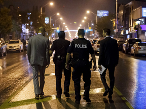 Toronto Police officers on Danforth Avenue, the scene of a deadly mass shooting on July 23, 2018.