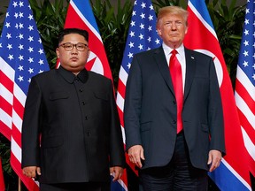 In this June. 12, 2018 photo, U.S. President Donald Trump, right, meets with North Korean leader Kim Jong Un on Sentosa Island, in Singapore.