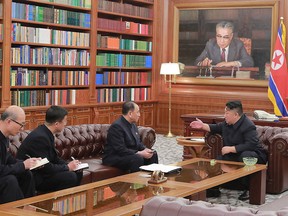 This Jan. 23, 2019 picture released from North Korea's official Korean Central News Agency (KCNA) shows North Korean leader Kim Jong Un (R) talking with delegates of the second U.S.-North Korea high-level talks to be held in Washington led by Kim Yong Chol, vice-chairman of the WPK Central Committee (2nd R), at an undisclosed location in North Korea.
